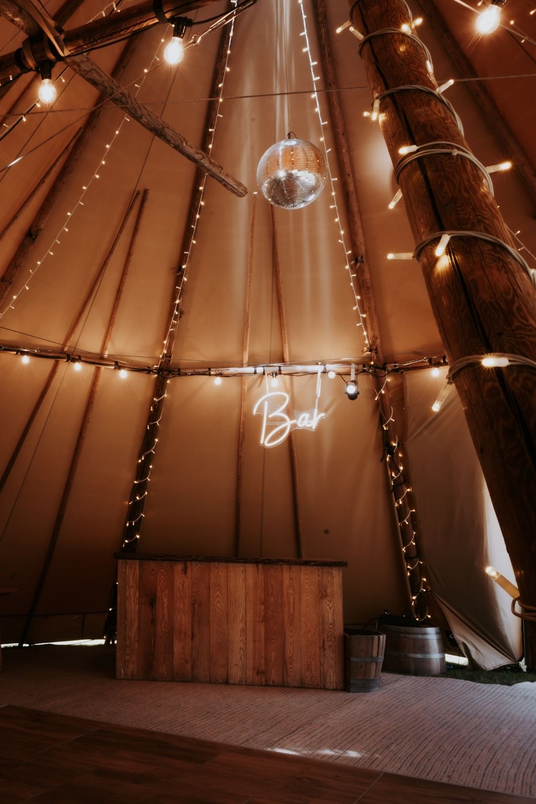 Couple celebrating their tipi wedding