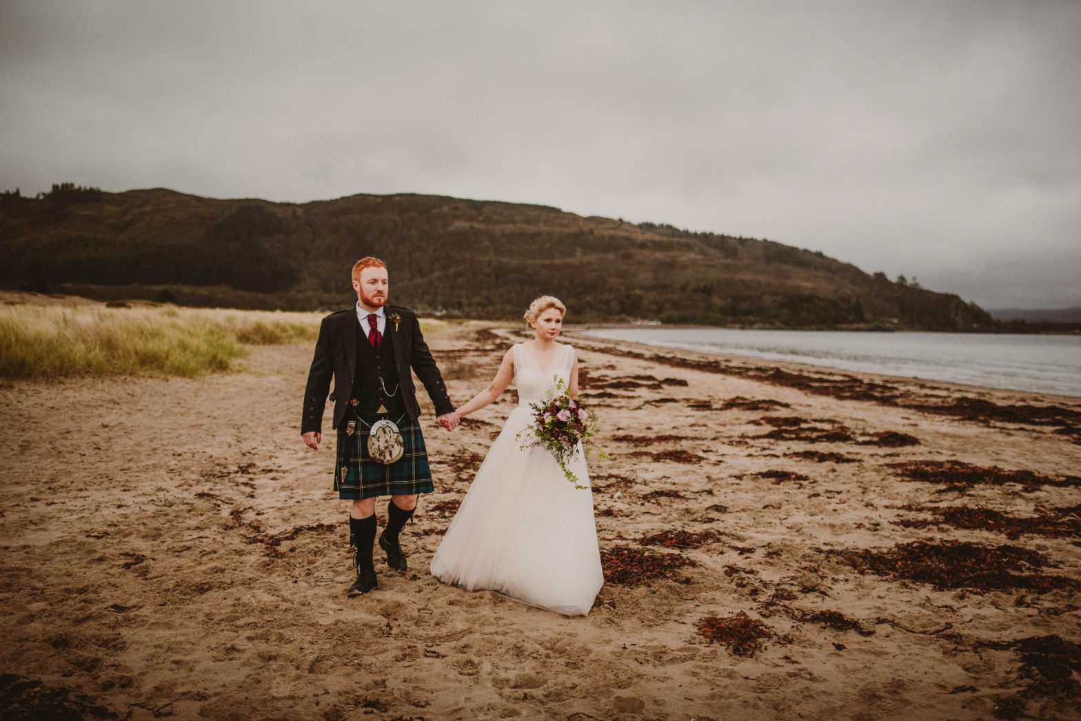 Couple entering tipi on wedding day
